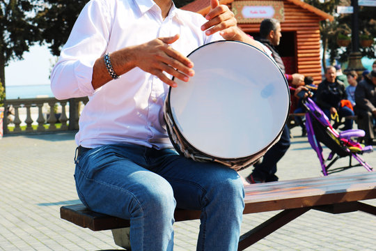 Young  azeri guy playing traditional drum nagara  - Azerbaijan, Baku