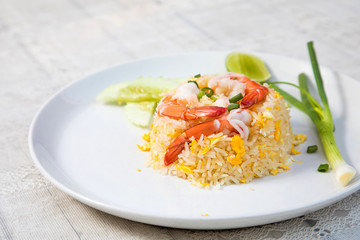 Fried rice with shrimp on the wooden table from top view