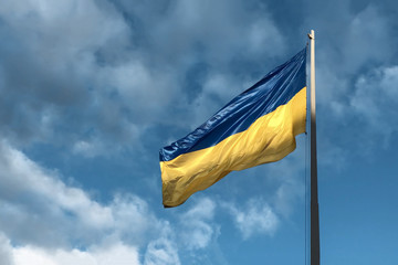 national symbol of ukrainian people - blue and yellow banner is fluttering in the wind.