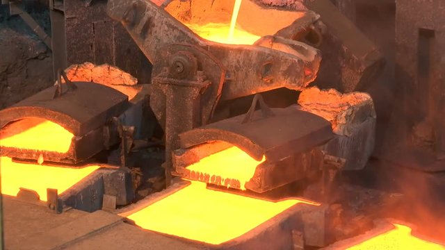 Glowing Liquid Metal in the Foundry / Processing of copper ore in the foundry,liquid metal is poured into molds