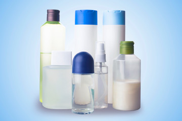 Flat lay composition with bottles of perfume on color background