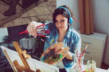 Female artist with paintbrush