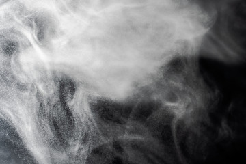 Abstract powder splatted background,Freeze motion of red powder exploding