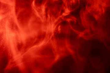Abstract powder splatted background,Freeze motion of red powder exploding