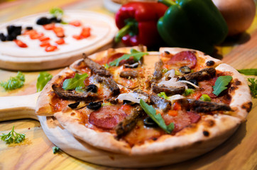 Slice of hot pizza cheese lunch or dinner crust seafood meat topping sauce with bell pepper...