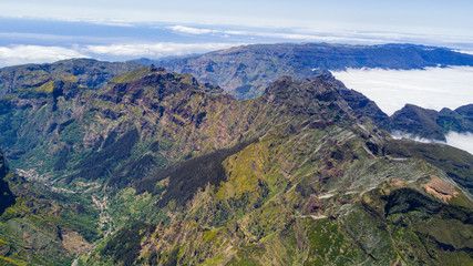 Fototapeta na wymiar Top view of Pico do Arieiro one of the highest peaks in Madeira island. Hiking trail from Pico do Arieiro to Pico Ruivo.