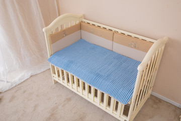 White children's beds, blue mattresses