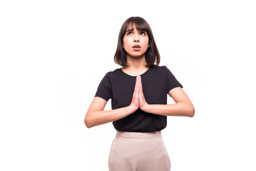Portrait of a beautiful woman praying, isolated on a white background