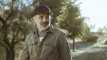 Happy man outdoors during sunny spring or summer day