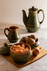 sauerkraut with boiled potatoes on a cutting board and a light background