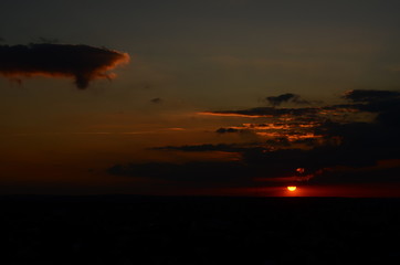 Sunset silhouette of church cross at sunset