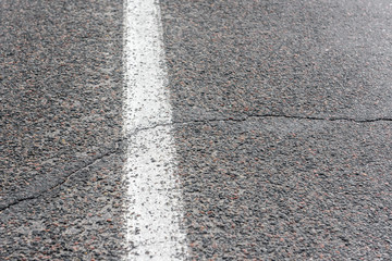 Fototapeta premium Cracks on the asphalt road.