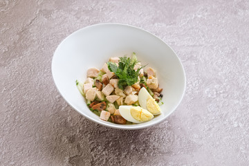 Salad with chicken, cucumber, mushrooms and eggs