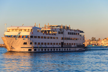 Fototapeta premium Cruise ship sailing on the Nile river, Egypt