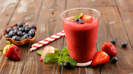 berry smoothie on wood background