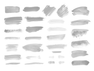 Watercolor design elements in gray. Brush stokes, splashes, splatters, blobs. Hand drawn, painted...