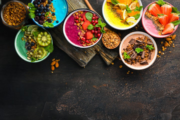 Colorful fruit smoothies with yogurt, fresh fruit and berries. Top view. Free space for your text.