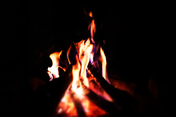 Fire flames close up over black background