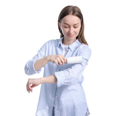 Woman with roller for cleaning clothes in hand on white background isolation