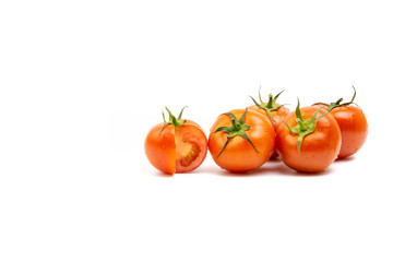 Tomato closeup on white background. Selective focus and crop fragment