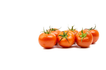 Tomato closeup on white background. Selective focus and crop fragment