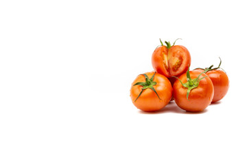 Tomato closeup on white background. Selective focus and crop fragment
