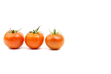 Tomato closeup on white background. Selective focus and crop fragment