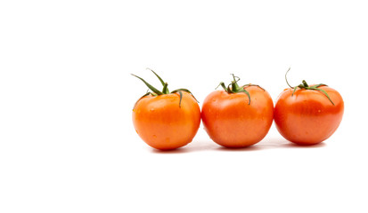 Tomato closeup on white background. Selective focus and crop fragment