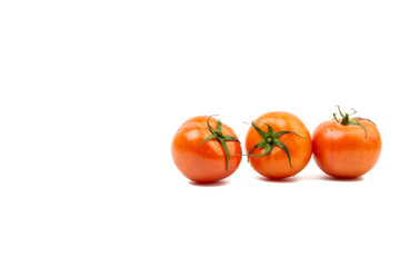 Tomato closeup on white background. Selective focus and crop fragment