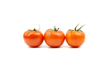 Tomato closeup on white background. Selective focus and crop fragment