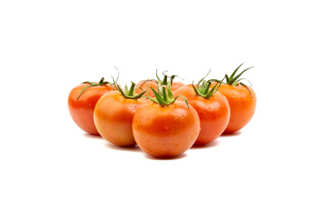 Tomato closeup on white background. Selective focus and crop fragment