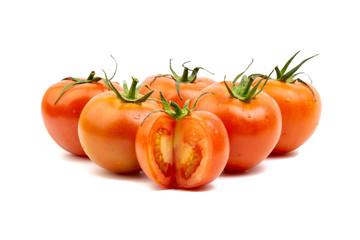 Tomato closeup on white background. Selective focus and crop fragment