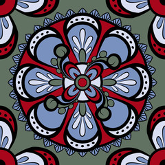 Seamless pattern with circular ornaments in dark blue, blue, red and green tones