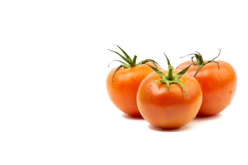 Tomato closeup on white background. Selective focus and crop fragment