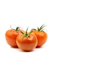 Tomato closeup on white background. Selective focus and crop fragment