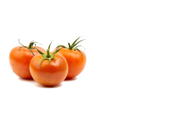 Tomato closeup on white background. Selective focus and crop fragment