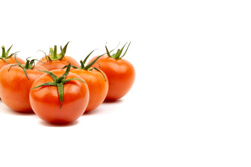 Tomato closeup on white background. Selective focus and crop fragment