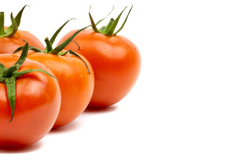 Tomato closeup on white background. Selective focus and crop fragment
