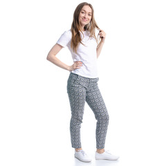 Woman in white t-shirt and pants standing smiling on white background isolation