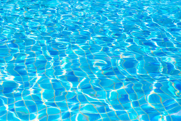 blue water ripple background and texture. water surface og swimming pool in summer time.