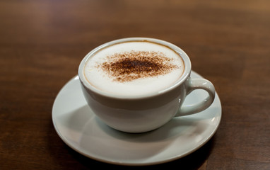 cup of coffee on wooden table