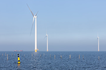 Offshore wind turbines near Dutch coast with buoy