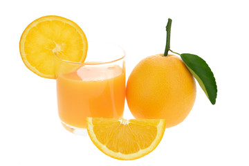 Orange juice and oranges with leaves