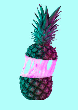 Naklejki A paradox. An alternative colorful pineapple filled with cream or pink bubblegym against blue background. Modern design. Food concept. Contemporary art collage. Negative space to insert your text.