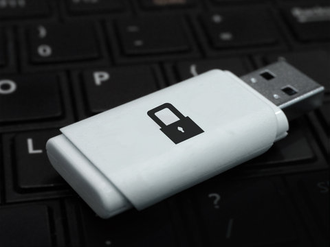 Secure digital file storage concept. Padlock security icon on a white USB Flash Drive. IT security and encryption.