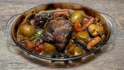 Homemade roasted beef topside with cherry tomatoes,oregano,garlic,carrot and onion