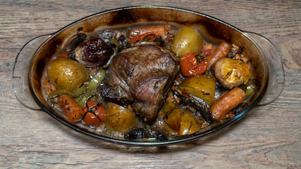 Homemade roasted beef topside with cherry tomatoes,oregano,garlic,carrot and onion