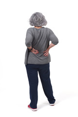 Fototapeta premium full portrait of the back of an older woman with pain in the back on white background