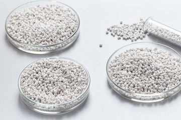A closeup of a white plastic resin in granules