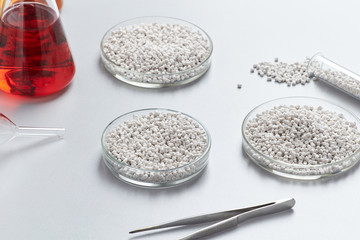 A closeup of a white plastic resin in granules